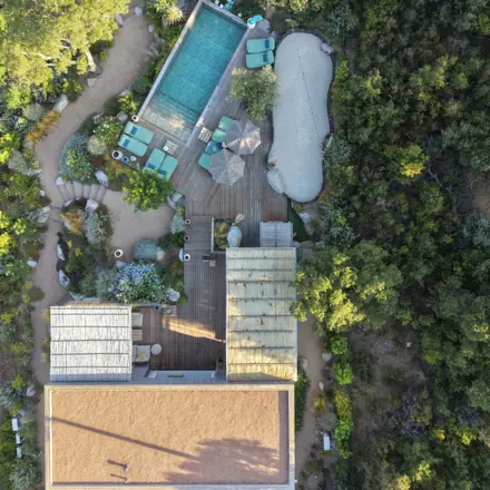 The villa from above, with its pool in the maquis